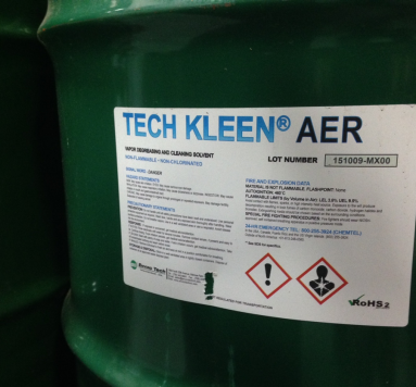 Tech Kleen AER industrial cleaning solvent drum with GHS hazard pictograms, illustrating toxicity concerns in contact cleaners and degreasers.